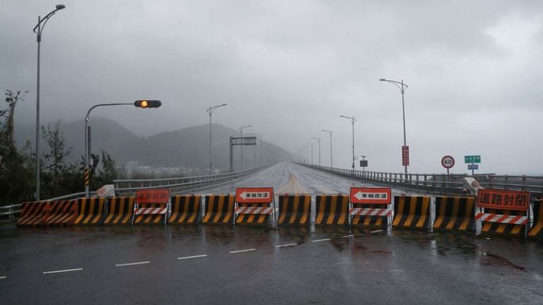 Typhoon Koinu brushes past southern Taiwan with lashing rain; kills one, 304 injured