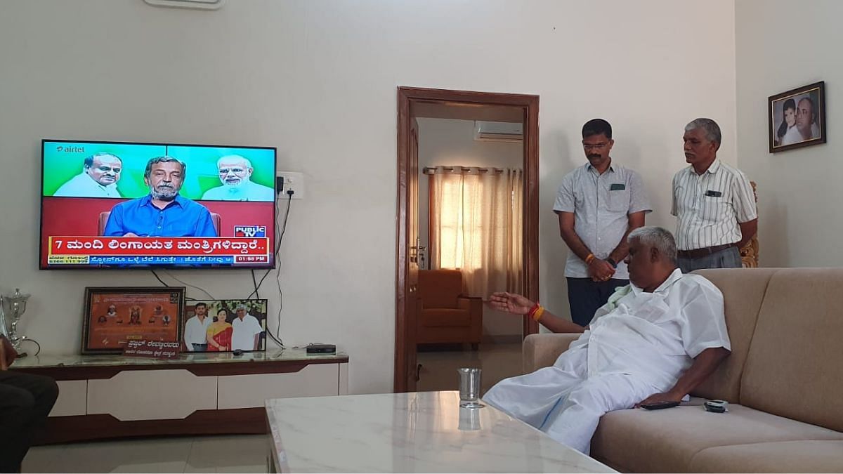 HD Revanna watches brother, HD Kumaraswamy’s interview on the BJP-JD(S) alliance | Photo: Sharan Poovanna | ThePrint