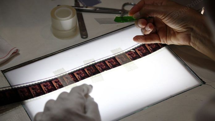 Marianna Sanctis working on an old film reel during the workshop| Suraj Singh Bisht, ThePrint