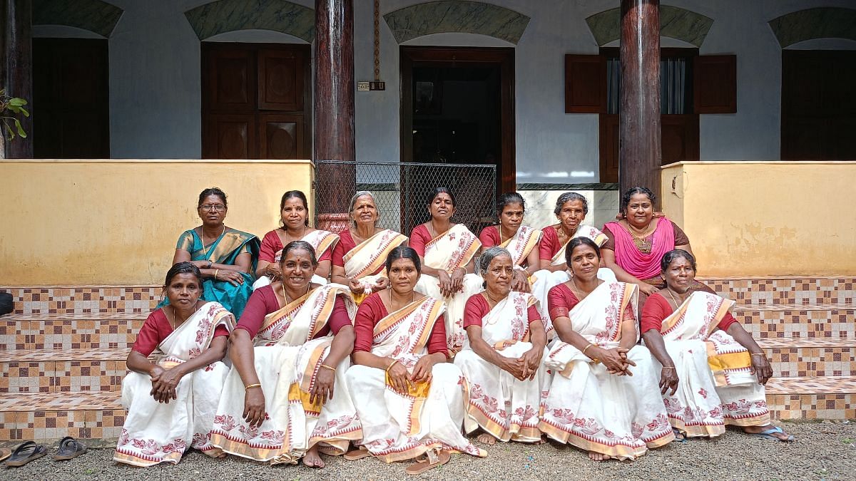 The lottery winners (in white) decked up in Kerala saris for an Onam programme | Tina Das | ThePrint