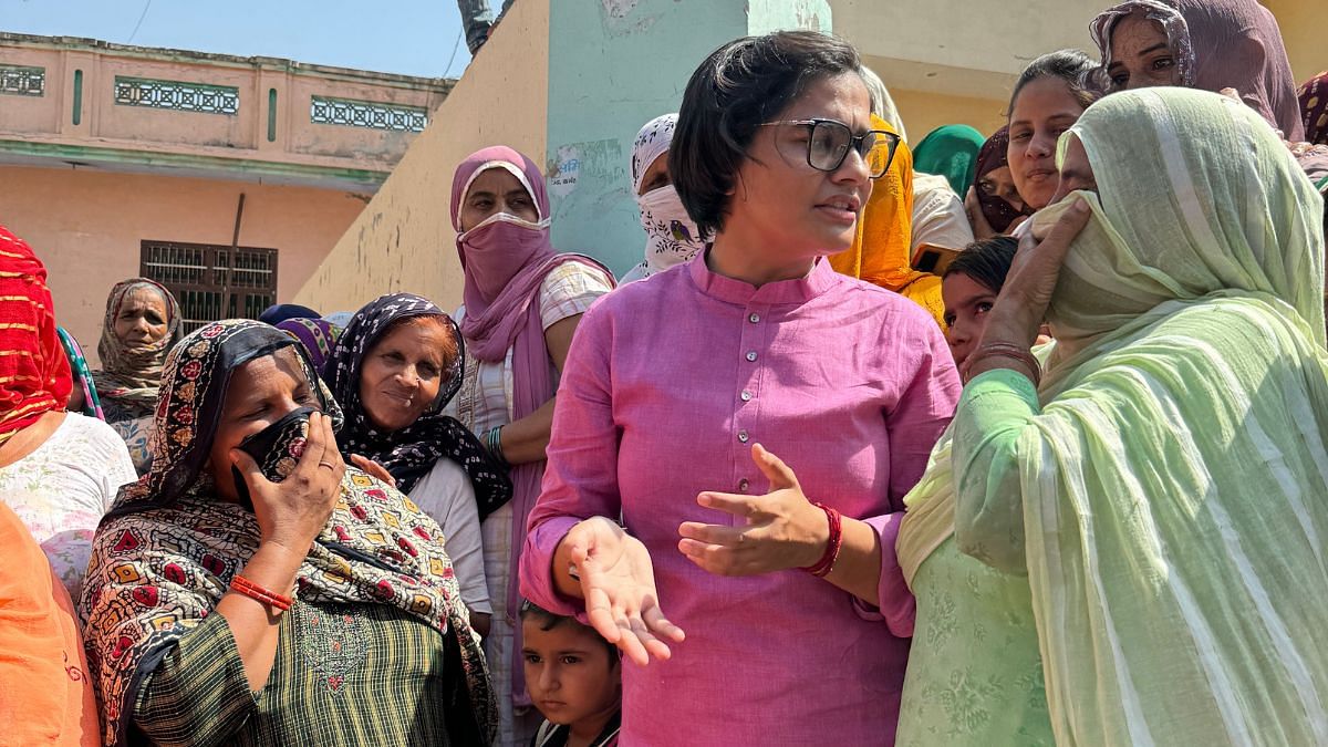 Doohan speaking to women after the panchayat. She asks them once again to remember the names of Brij Bhushan Singh and Sandeep Singh. | Sagrika Kissu | ThePrint