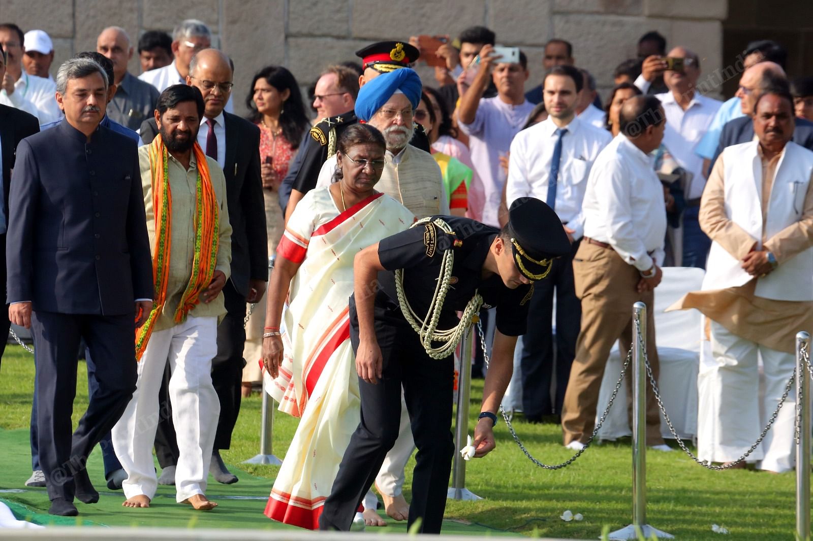 Aide De Camp (ADC) to the President picking up a flower at Rajghat | Praveen Jain | ThePrint
