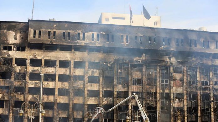 Efforts are made to douse a fire that broke out at a police facility, in Ismailia, Egypt October 2, 2023. REUTERS/Mohamed Abd El Ghany