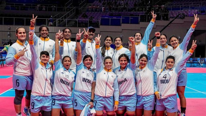 Indian team poses for photos after winning the Women's Team Gold Medal Kabaddi match against Chinese Taipei at the 19th Asian Games, in Hangzhou, China, on Saturday | PTI Photo/Gurinder Osan