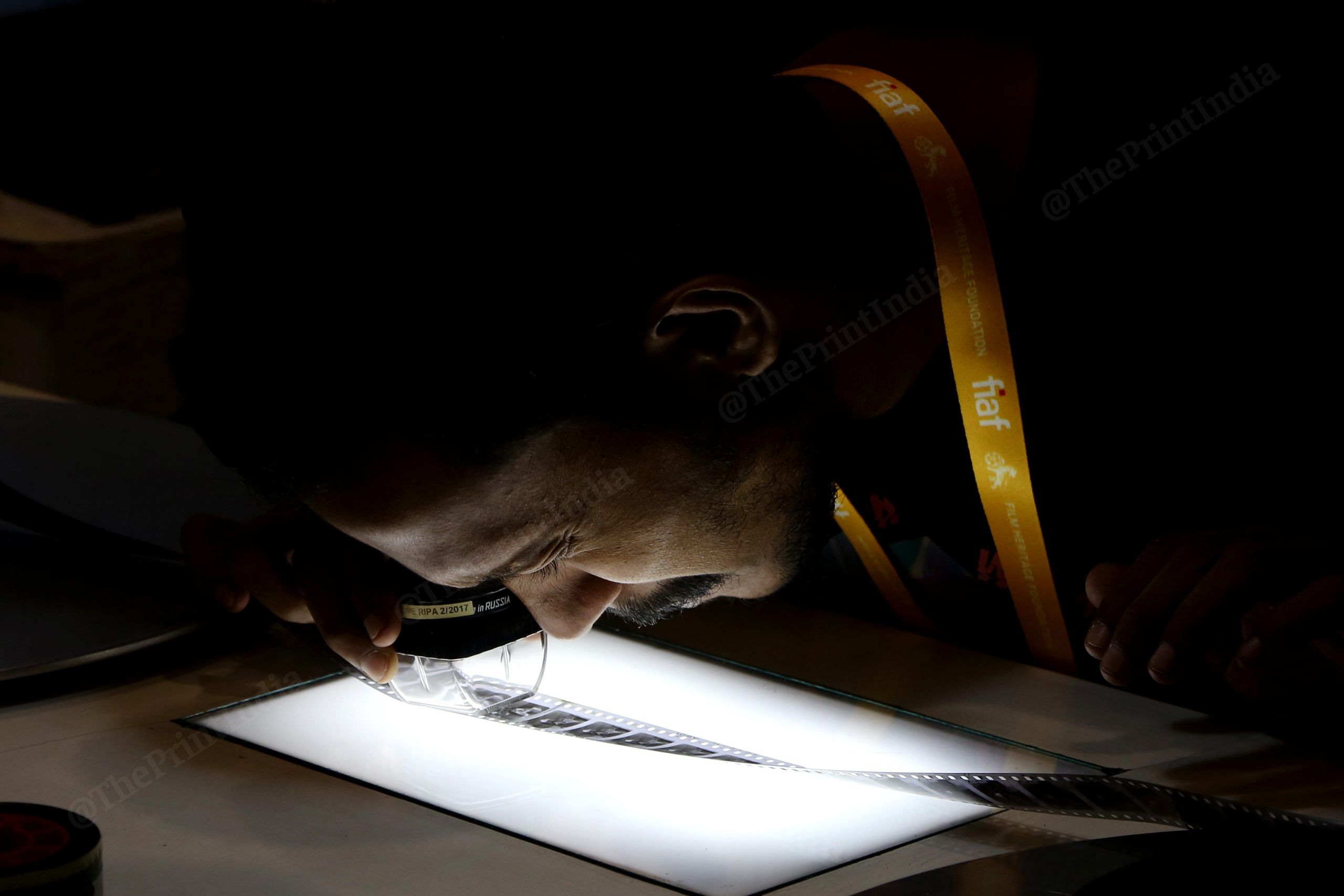 A student takes a closer look at a film reel during the workshop| Suraj Singh Bisht, ThePrint