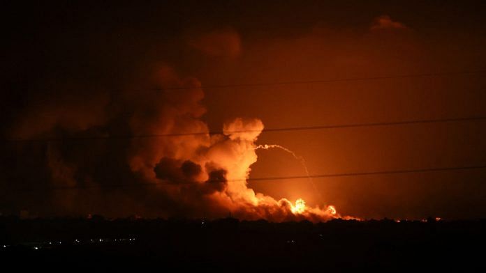 Smoke and flames rise during Israeli strikes in the Gaza Strip, as seen from the Israeli side of the border with Gaza, in southern Israel | Reuters