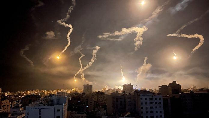 Flares are dropped by Israeli forces, amid the ongoing conflict between Israel and Palestinian Islamist group Hamas, in Gaza City | Reuters