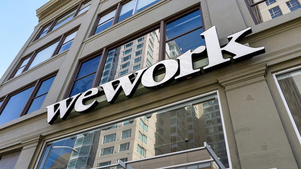 A WeWork logo is seen outside its offices in San Francisco, California, U.S. | Reuters