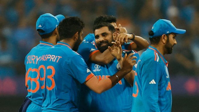 ICC Cricket World Cup 2023 - Semi-Final - India v New Zealand - Wankhede Stadium, Mumbai, India - November 15, 2023 India's Mohammed Shami celebrates his five-wicket-haul with teammates after taking the wicket of New Zealand's Daryl Mitchell, caught out by Ravindra Jadeja | Reuters