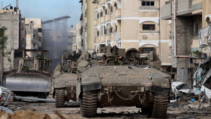 Israeli tanks operate in Gaza City, amid the ongoing ground operation of the Israeli army against Palestinian Islamist group Hamas, in the Gaza Strip | Reuters