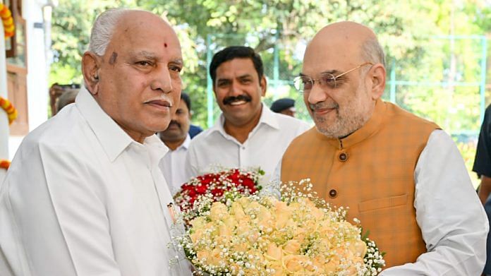 Union Home Minister Amit Shah meets former Karnataka Chief Minister B.S.Yediyurappa, at the latter's residence, in Bengaluru in March this year. B. Y. Vijayendra is also seen at the back | File Photo: ANI