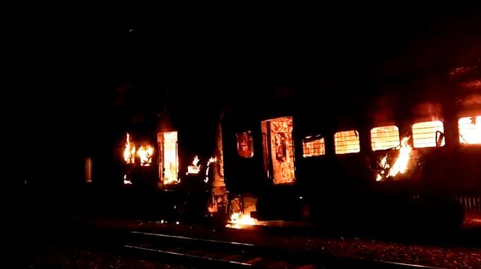 A video grab shows the flames billowing out from the S1 coach of train 02570 Darbhanga Clone Special that caught fire when it was passing through the Sarai Bhopat Railway station, on Wednesday | ANI