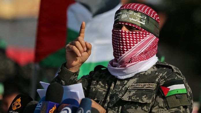 Abu Ubaida, the spokesman of the Izz el-Deen al-Qassam Brigades, gestures as he speaks during an anti-Israel military show in the southern Gaza Strip in Nov 2019 | Reuters file photo