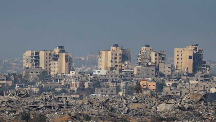 A view of destroyed buildings in Gaza, as seen from southern Israel, amid the ongoing conflict between Israel and the Palestinian group Hamas, Wednesday | REUTERS/Alexander Ermochenko
