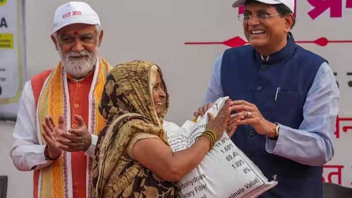 Consumer affairs minister Piyush Goyal hands over a Bharat Atta packet to a beneficiary in New Delhi Monday | Photo: PTI