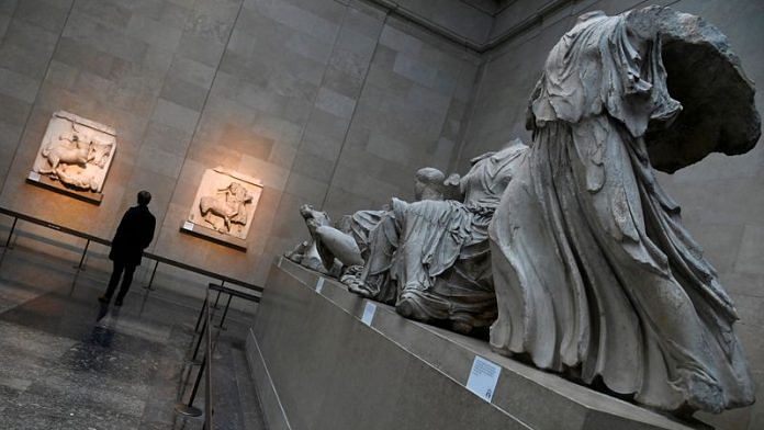 An employee views examples of the Parthenon sculptures, sometimes referred to in the UK as the Elgin Marbles, on display at the British Museum in London, Britain, January 25, 2023. REUTERS/Toby Melville/File Photo