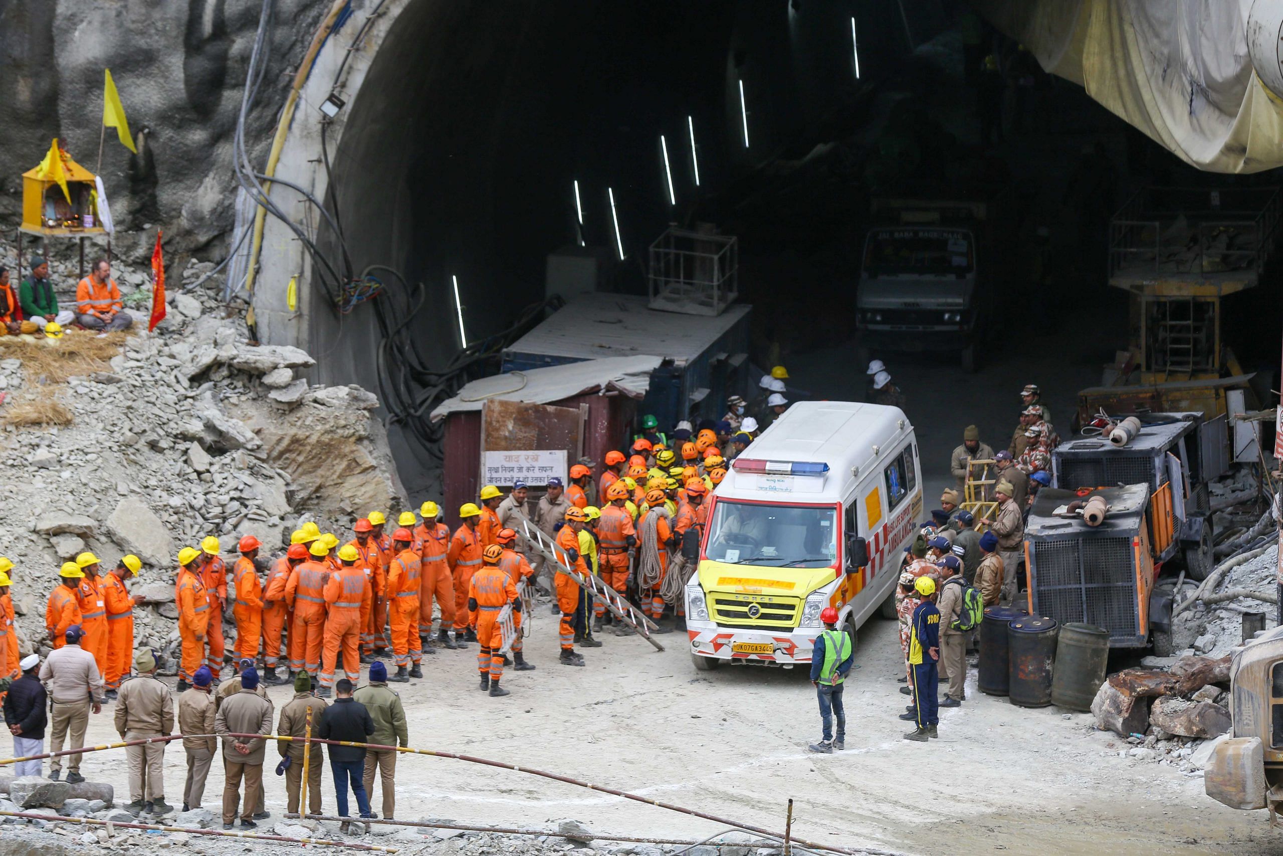 National Disaster Response Force (NDRF) personnel along with other rescue operatives gather near the face of the collapsed under construction Silkyara tunnel in the Uttarkashi district | Suraj Singh Bisht | ThePrint