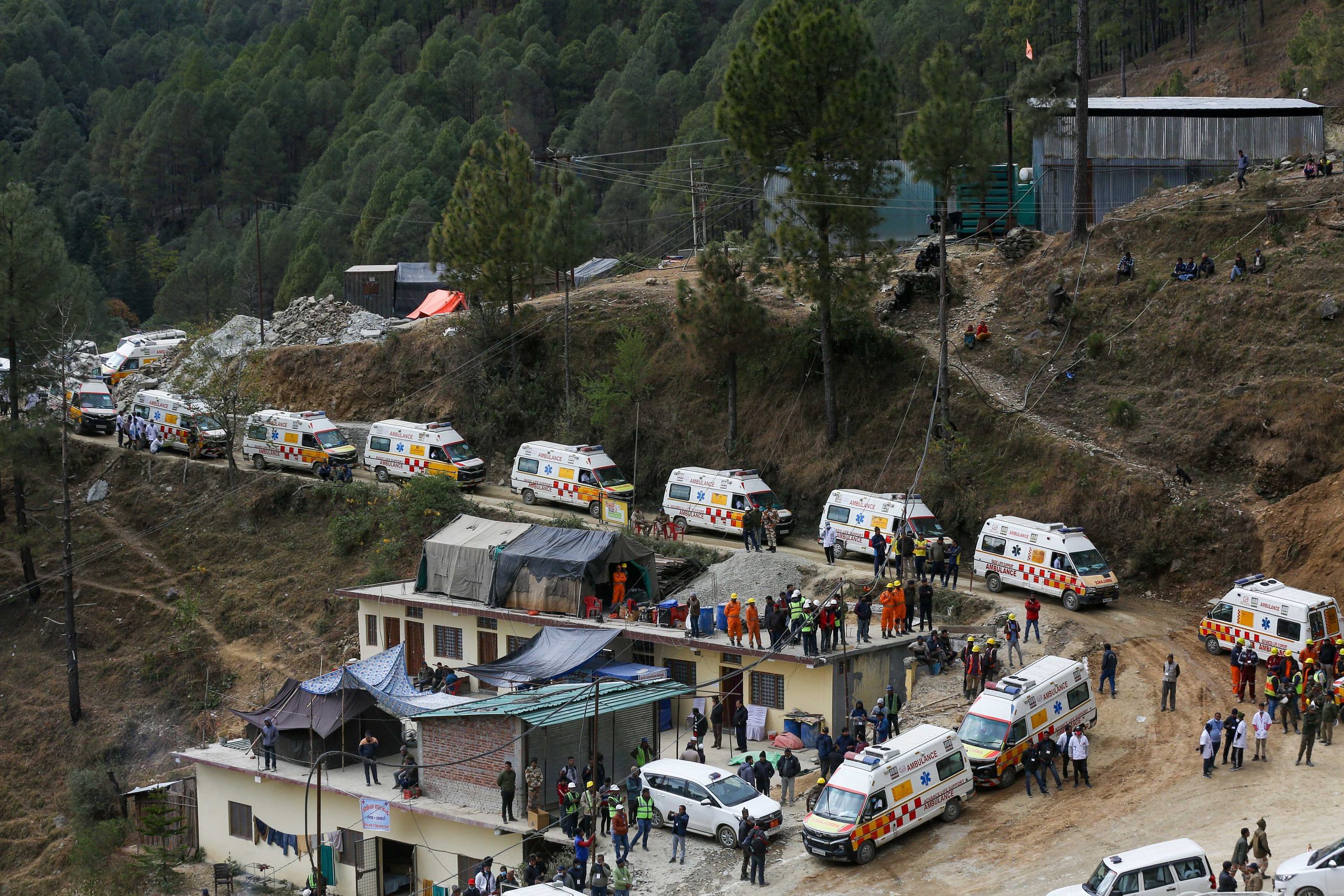 Ambulance and emergency vehicles are on standby near the face of the collapsed under construction Silkyara tunnel | Suraj Singh Bisht | ThePrint