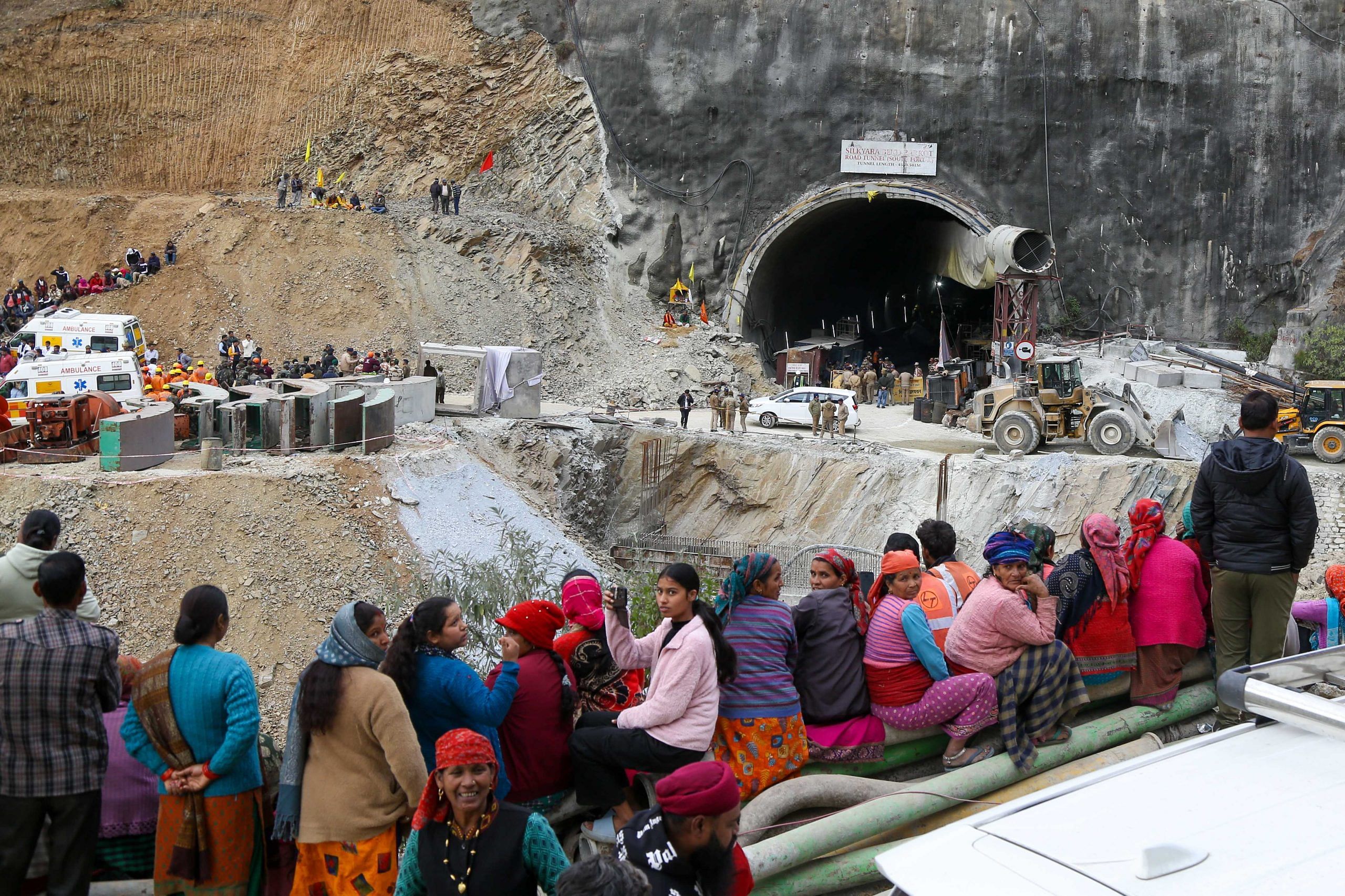 Villagers and locals gather to look at the efforts by the operatives to rescue the 41 men trapped inside the collapsed under construction Silkyara tunnel in the Uttarkashi district of India's Uttarakhand state | Suraj Singh Bisht | ThePrint