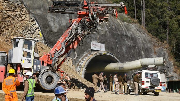 Workers make road for the vertical drilling on top of the mountain face below which an under construction tunnel has collapsed in the district of Uttarkashi | ThePrint photo by Suraj Singh Bisht