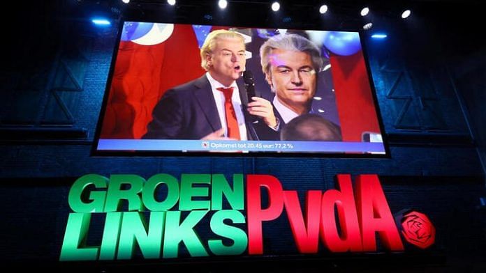 Dutch far-right politician and leader of the PVV party Geert Wilders appears on a screen as supporters of Frans Timmermans, former EU Commissioner for Climate Action and leading candidate for the GroenLinks-PvdA, gather to watch the exit poll and early results in the Dutch parliamentary elections in Amsterdam, Netherlands on Wednesday | REUTERS/Wolfgang Rattay