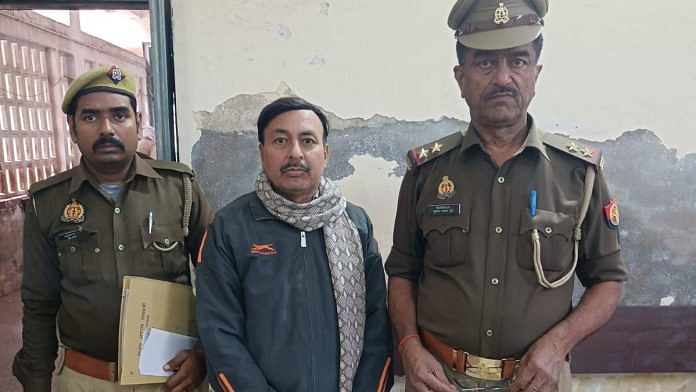 Headmaster Rajesh Kumar with the Unnao police Monday | Photo: By special arrangement