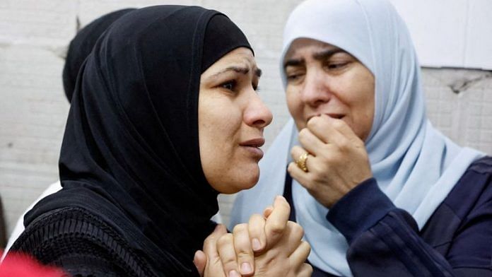 Womean react as they mourn Palestinians who were killed in an Israeli raid, in Tulkarm, in the Israeli-occupied West Bank on Tuesday | REUTERS/Raneen Sawafta