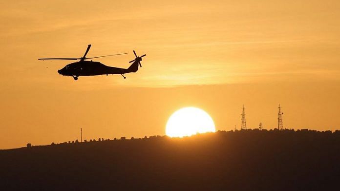 An Israeli military helicopter flies over Northern Israel near the border with Lebanon | Reuters