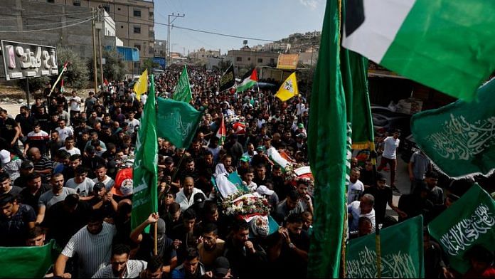 Mourners attend the funeral of four Palestinians killed in clashes with Israeli settlers, near Nablus in the Israeli-occupied West Bank | Reuters