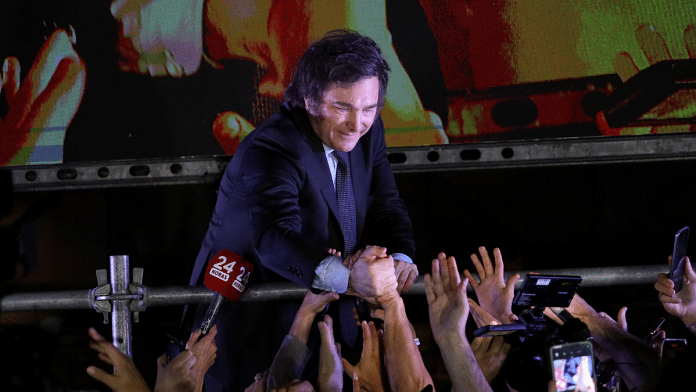 Argentine president-elect Javier Milei greets supporters after winning Argentina's runoff presidential election, in Buenos Aires, Argentina November 19, 2023 | Reuters