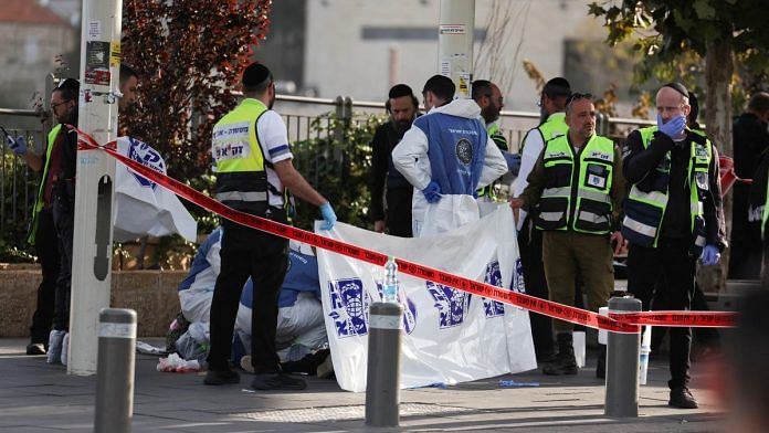 Israeli officials work at the scene of a violent incident in Jerusalem | Reuters