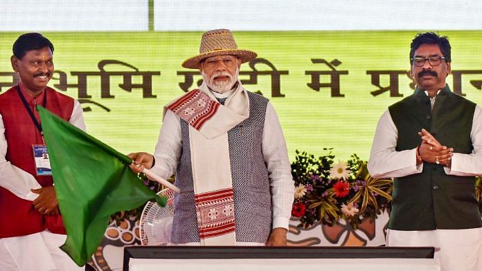 Prime Minister Narendra Modi, seen here with Jharkhand Chief Minister Hemant Soren and Union Tribal Affairs Minister Arjun Munda, flags off development projects on ‘Janjatiya Gaurav Divas' and Jharkhand Foundation Day celebrations in Khunti, Jharkhand, Wednesday | PTI Photo