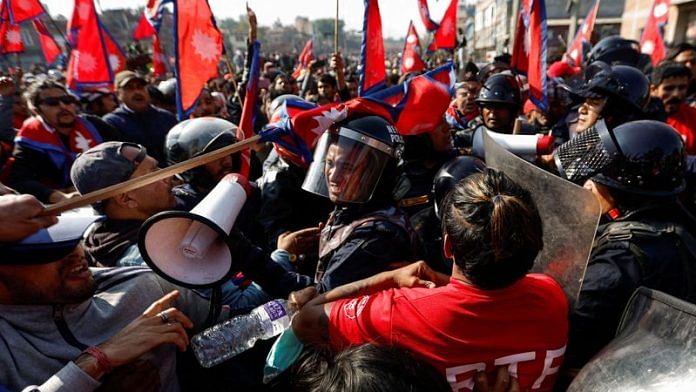 A riot police personnel gets a hit on his helmet during the clash with Pro-monarchist protesters as they protest demanding the restoration of Nepal's monarchy, which was abolished in 2008, saying the governments have failed to make any significant changes in Kathmandu, Nepal on Thursday | REUTERS/Navesh Chitrakar