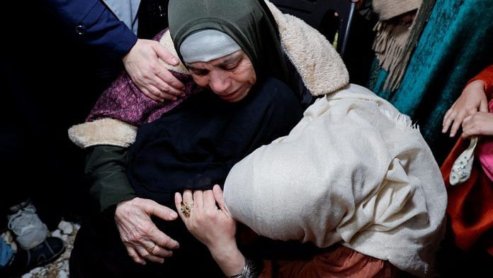 Family members react as they welcome released Palestinian prisoner Fatima Amarneh near Jenin in the Israeli-occupied West Bank | Reuters