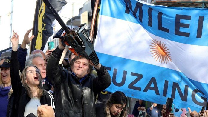File photo of Argentina's President-elect Javier Milei holding a chainsaw | Reuters/Cristina Sille