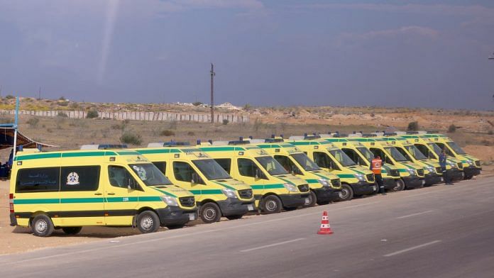 Ambulances are seen on the day of Egyptian PM Mostafa Madbouly's visit to the Rafah border crossing between Egypt and the Gaza Strip, on 31 October 2023 | Reuters