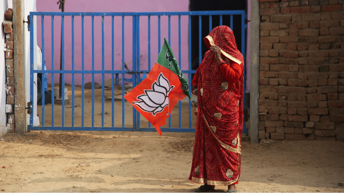 A woman holding a BJP flag in Amber | Manisha Mondal | ThePrint
