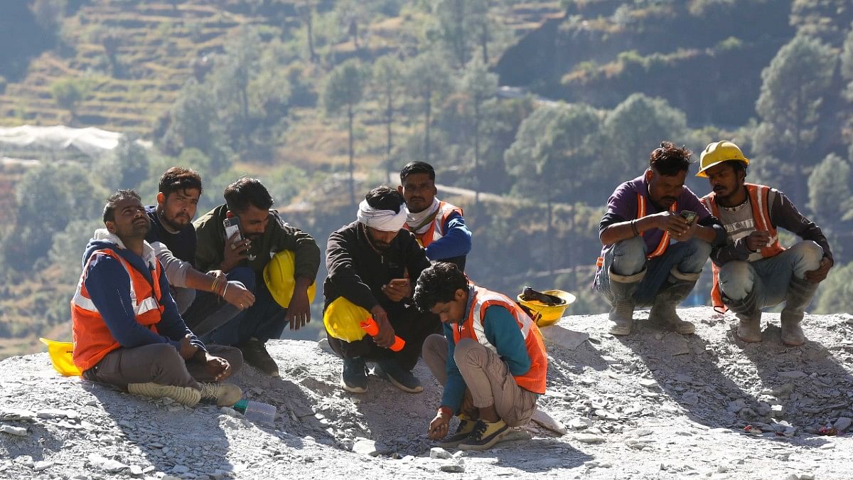 Labourers sitting near site of under-construction tunnel | Suraj Singh Bisht | ThePrint