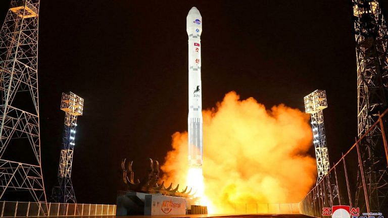 North Korea says its first spy satellite placed in orbit, vows to launch more