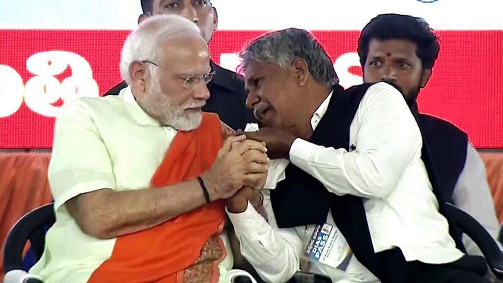 PM Narendra Modi consoles Manda Krishna Madiga who got emotional during the rally | ANI