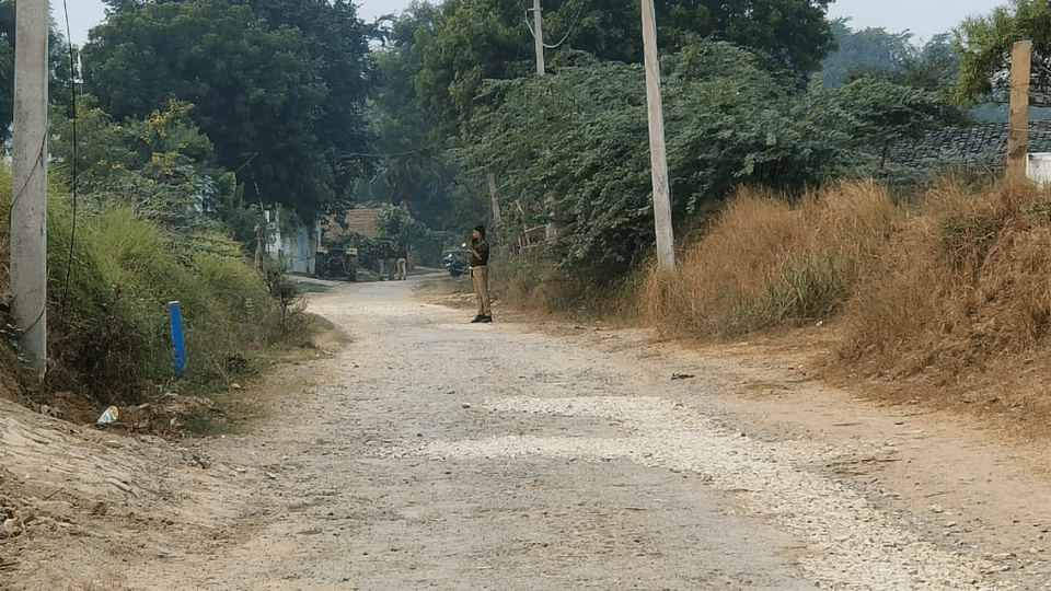 A Kaushambi policeman at the village where the murder took place. Two accused are already in police net | By Special Arrangement 