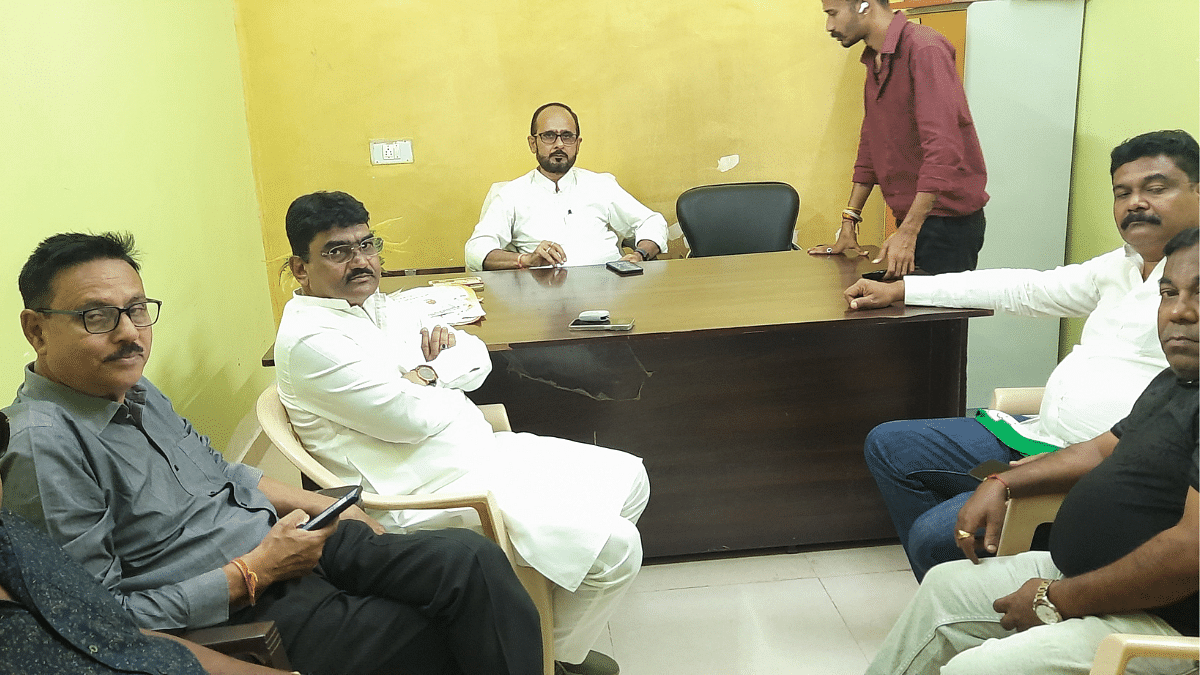 Syed Sattar Ali (white kurta-clad, occupying the white plastic chair) | Sourav Roy Barman | ThePrint