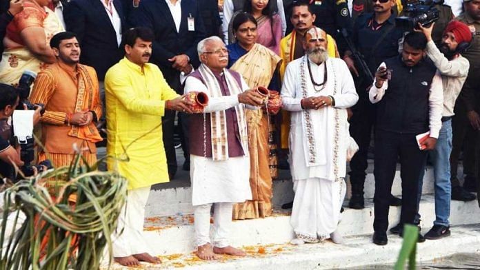 Haryana CM Manohar Lal Khattar participates in Chhath Puja festivities in Panipat Sunday, alongside Delhi MP Manoj Tiwari (in yellow) | By special arrangement