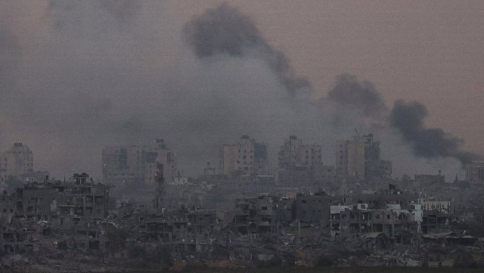 Smoke rises above Gaza as seen from southern Israel, on 13 November 2023 | Reuters