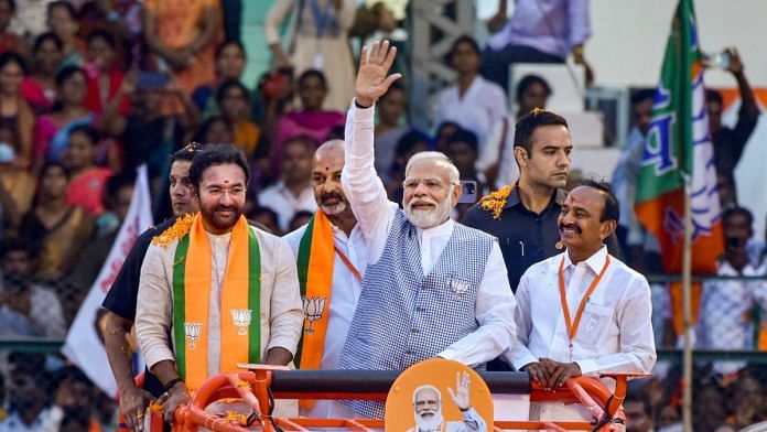 Prime Minister Narendra Modi with Union Minister and Telangana state BJP President G Kishan Reddy and others responds to the crowd during BJP's 'BC Atma Gourava Sabha', in Hyderabad, Tuesday, Nov. 7, 2023. (PTI Photo)