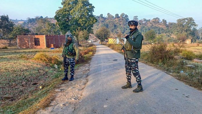Security personnel stand guard during an encounter with terrorists, at Baji Maal area of Rajouri district, Thursday, Nov. 23, 2023. (PTI Photo)