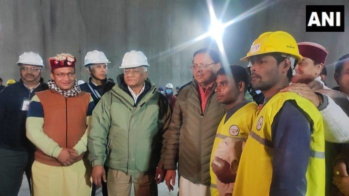 Uttarakhand CM Pushkar Singh Dhami and Union minister General V.K. Singh (Retd) with two of the rescued workers | ANI