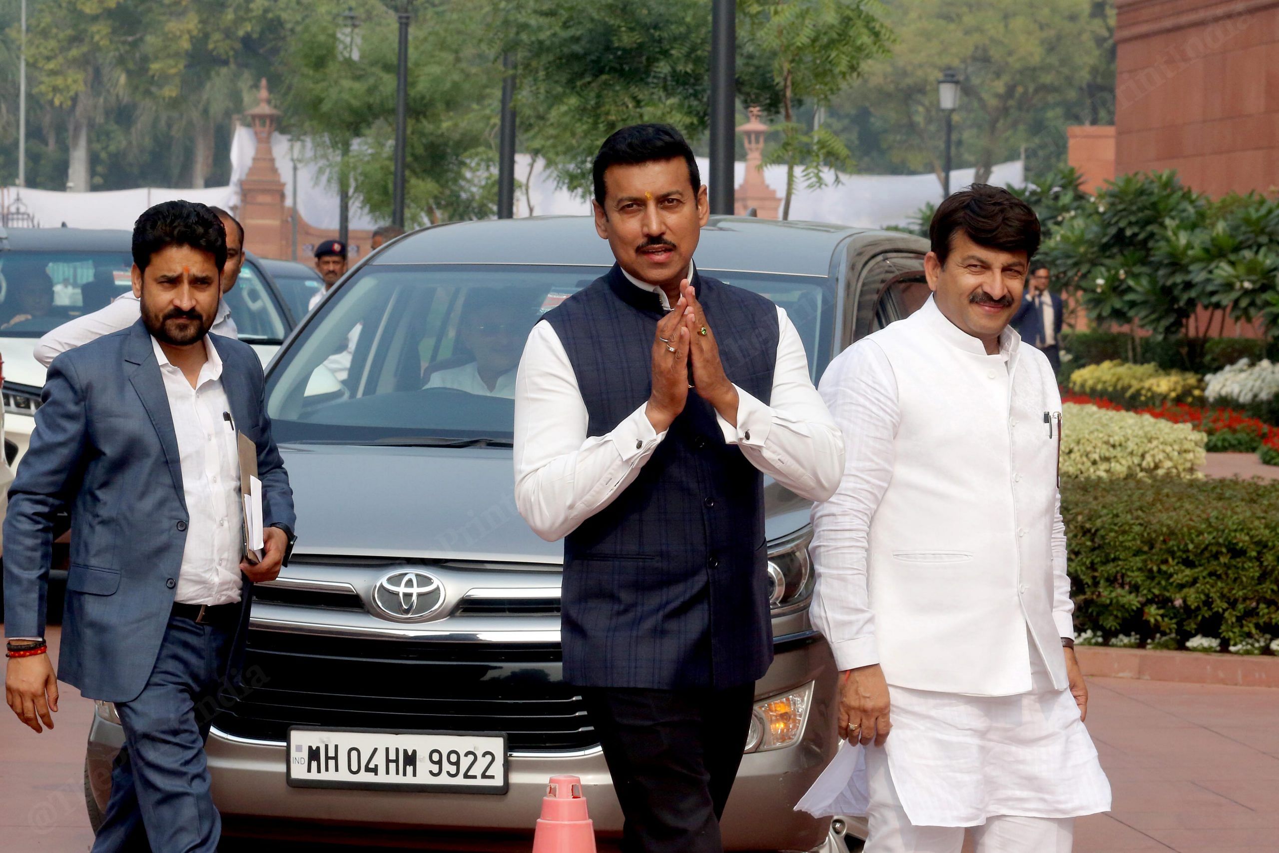 BJP MP Rajyavardhan Rathore and Manoj Tiwari arrives at Parliament house on the first day of the Winter session | Praveen Jain | ThePrint