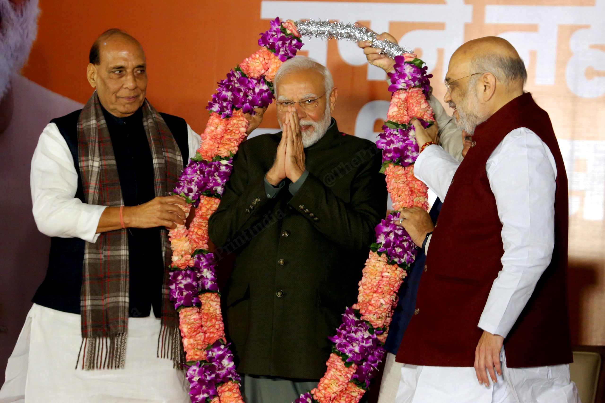 Prime Minister Narendra Modi with Defence Minister Rajnath Singh and Union Home Minister Amit Shah during celebrations after party's victory in elections to the Legislative Assemblies of Madhya Pradesh, Rajasthan and Chhattisgarh, at BJP headquarters | Praveen Jain | ThePrint