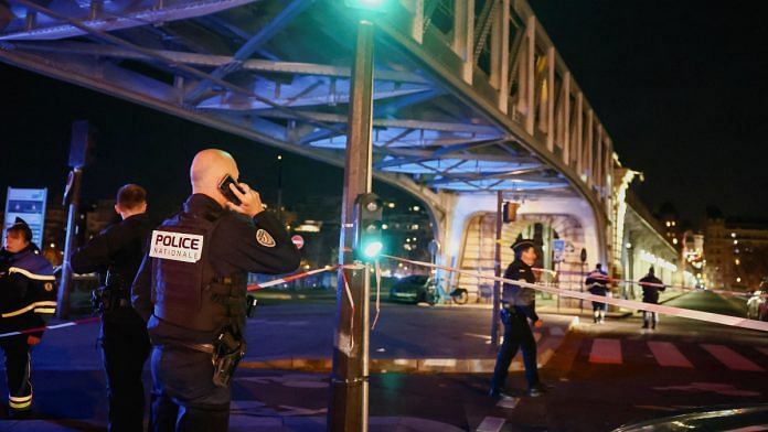French police secures the access to the Bir-Hakeim bridge after a security incident in Paris, France | Reuters